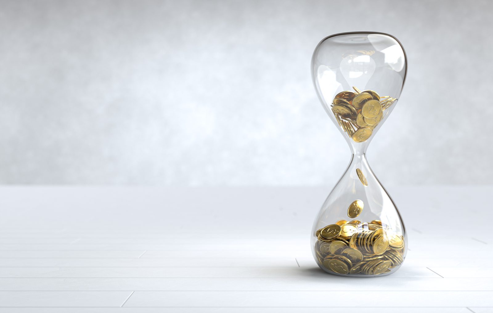Time and money, an hourglass of gold coins
